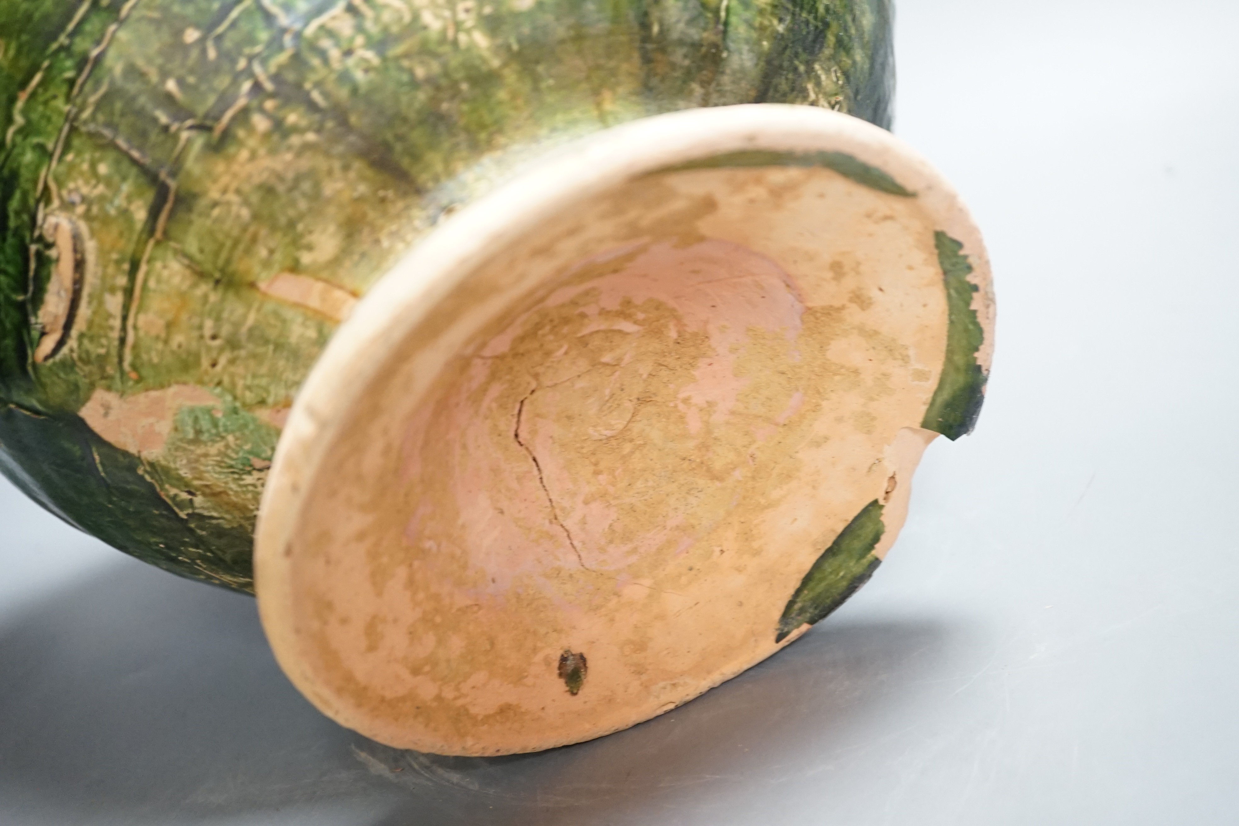 A large Chinese green glazed jar and cover, Liao dynasty, 35cm high
